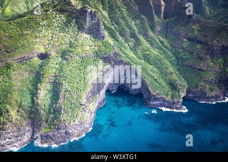 A helicopter tour is a breathtaking way to see the amazing aerial scenery of Kauai, Hawaii, USA including the famed Na Pali Coast Stock Photo