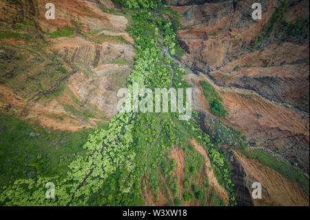 A helicopter tour is a breathtaking way to see the amazing aerial scenery of Kauai, Hawaii, USA including the famed Na Pali Coast and  Waimea Canyon Stock Photo