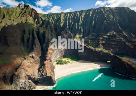 Honopo Beach is sheltered by 1200 foot cliffs; A helicopter tour is a breathtaking way to see amazing aerial scenery of Kauai, Hawaii's Napali Coast Stock Photo