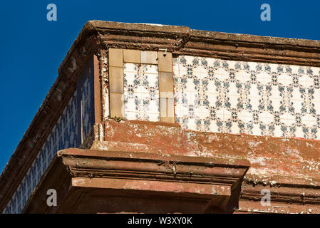 Close up traditional portuguese ceramic tiles ( Azulejos) on the facade of a house in Olhao Portugal Stock Photo