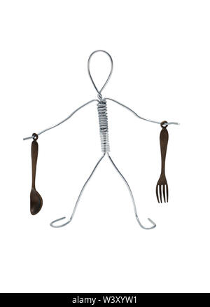 Man made from aluminum wire holding spoon and fork Stock Photo