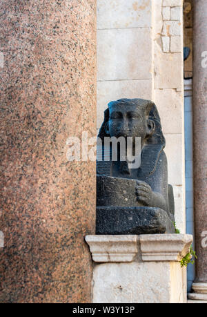 Egyptian sphinx outside the Cathedral of St Domnius in Split Croatia. The black granite sphinx is from 1500 BC and is within the Diocletian's Palace Stock Photo