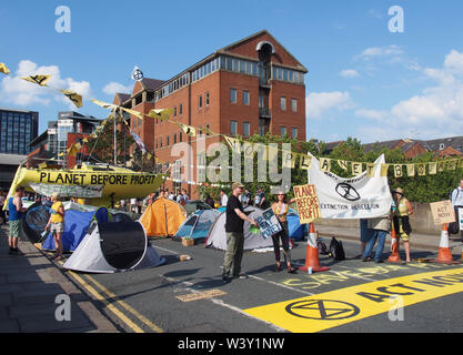 leeds, west yorkshire, united kingdom - 16 july 2019: extinction rebellion protesters blocking thee road at victoria bridge in leeds west yorkshire ho Stock Photo