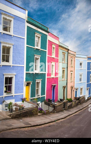 Brightly coloured terraced houses along a street in Cliftonwood and Hotwells in Bristol UK Stock Photo