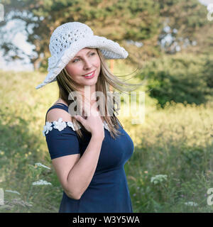 Lifestyle environmental portrait. Latvian model  with flowers. Stock Photo