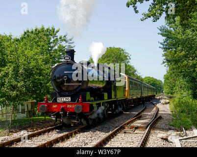 NER T2 steam loco hauling two Class 101 diesel railcars approaches Hardingham Station on the Mid-Norfolk Railway during the 2019 steam gala. Stock Photo