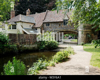 A view of Pull's Ferry, the river entrance to Norwich Cathedral Close and site of a 16th century ferry across the River Wensum. Stock Photo