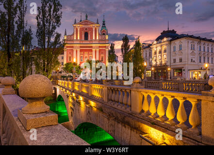 The Pink Franciscan Church and the triple bridge Tromostovje at night  Ljubljana Slovenia EU Europe Stock Photo