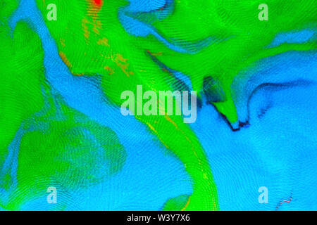 Mixed blue-green flat plasticine texture with distinct fingerprints. Small dust particles on surface. Stock Photo
