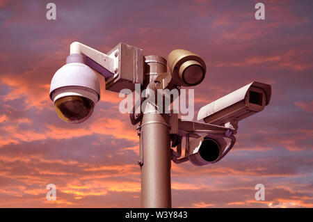 closed circuit camera Multi-angle CCTV system. against a red sky Stock Photo