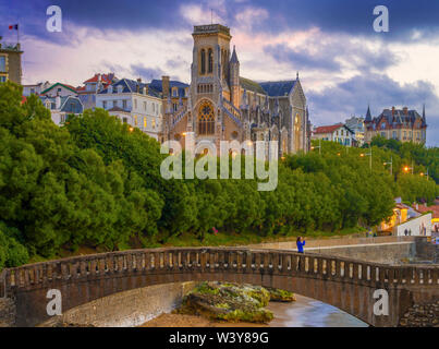 France, Aquitaine, Pyrenees Atlantiques, Biarritz, Saint Eugenia church at old port, dusk Stock Photo