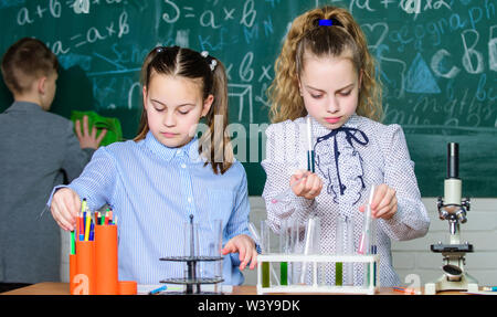 Little children. Science. Little kids scientist earning chemistry in school lab. biology experiments with microscope. Chemistry science. Lab microscope and testing tubes. School curriculum. Stock Photo