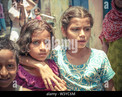 Amroha, Utter Pradesh, INDIA - 2011: Unidentified poor people living in slum - smiling children Stock Photo