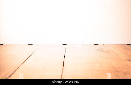 Empty room or apartment with wooden floor and light grey concrete wall Stock Photo