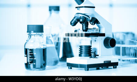 Test tubes and flasks and microscope in a chemical laboratory Stock Photo