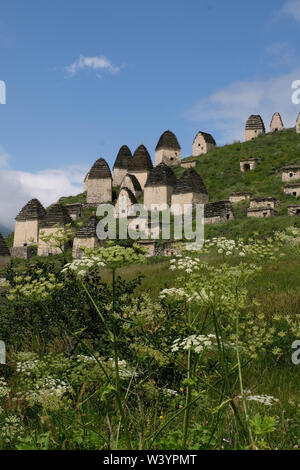View of tombs and crypts of the Alanian necropolis dating back to the 12th century outside the village of Dargavs known locally as the “city of the dead,“ located in Prigorodny District of the Republic of North Ossetia-Alania in the North Caucasian Federal District of Russia. Stock Photo