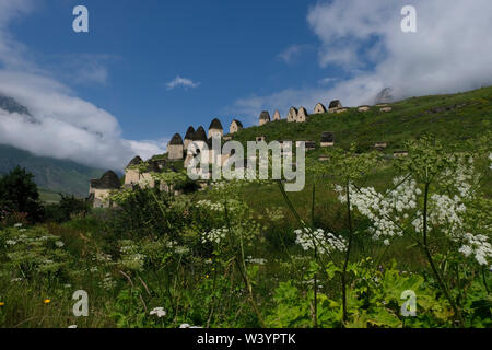 View of tombs and crypts of the Alanian necropolis dating back to the 12th century outside the village of Dargavs known locally as the “city of the dead,“ located in Prigorodny District of the Republic of North Ossetia-Alania in the North Caucasian Federal District of Russia. Stock Photo