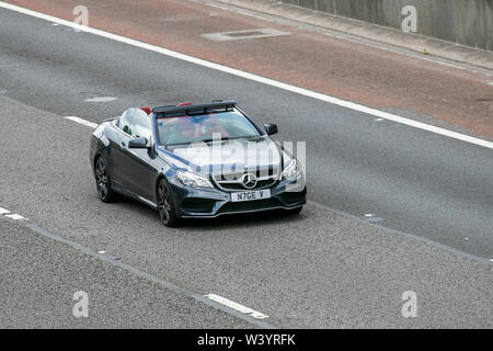 2015 Mercedes-Benz E220 AMG Line Bluetec AUT; UK Vehicular traffic, transport, modern, saloon cars, south-bound on the 3 lane M6 motorway highway. Stock Photo