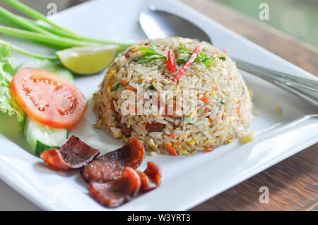 stir-fried rice with deep fried sausage and vegetable Stock Photo