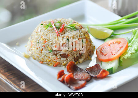 stir-fried rice with deep fried sausage and vegetable Stock Photo