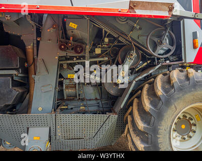 View of right hand side of a Massey Ferguson 7278 combine harvester with open guards showing the mechanism beneath Stock Photo