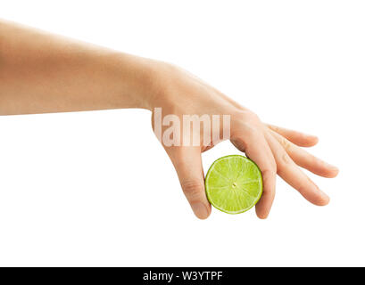 sliced lime in squeezing hand path isolated on white Stock Photo