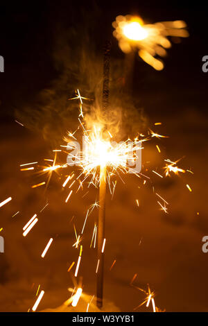 Burning Bengal New Year's fire on a black background Vertical Stock Photo