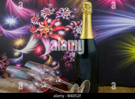 A bottle of sparkling wine, champagne, next to a champagne glass. Dark background with abstract colorful flowers. Stock Photo