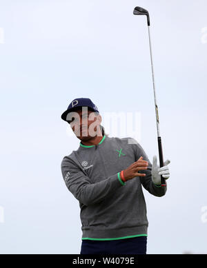 Rickie Fowler watches his tee shot on the 18th hole during the second ...