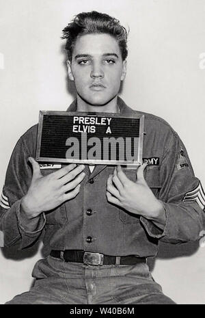 ELVIS PRESLEY (1935-1977) American singer and film actor in his official army records photo from March 1958 Stock Photo