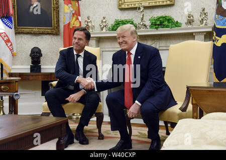 Washington, District of Columbia, USA. 18th July, 2019. US President Donald Trump shakes hands with Prime Minister Mark Rutte of the Netherlands in the Oval Office of the Washington, DC, on July 18, 2019. Credit: Olivier Douliery/Pool via CNP Credit: Olivier Douliery/CNP/ZUMA Wire/Alamy Live News Stock Photo