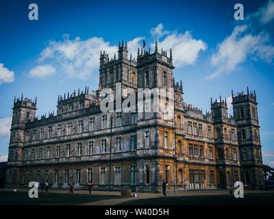 Low angle wide shot of the Highclere Castle on a sunny day Stock Photo