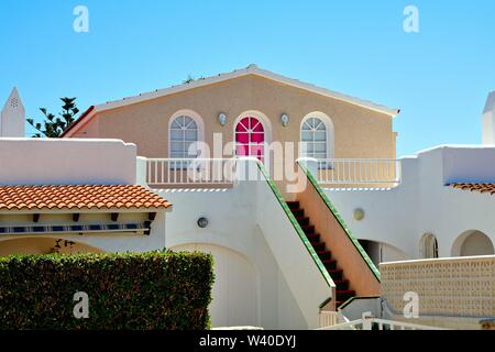 Abstract shapes formed by modern Spanish houses in strong sunlight , Cala Blanca Minorca  Balearic Islands Spain Europe Stock Photo