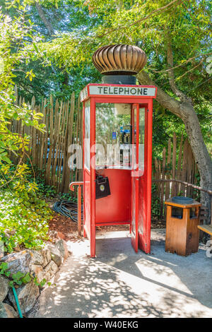 Highly unusual and humorous British Red Telephone Box with a huge turbine wind ventilator on top at Nepenthe restaurant in Big Sur, California. Stock Photo