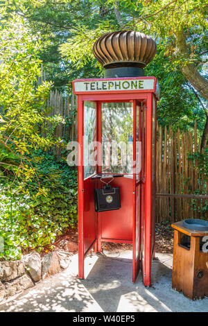 Highly unusual and humorous British Red Telephone Box with a huge turbine wind ventilator on top at Nepenthe restaurant in Big Sur, California. Stock Photo