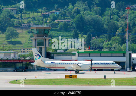 Agno, Ticino, Switzerland - 30th June 2019 : View on the Lugano-Agno airport with a parked air Adria Airplane located in the Canton of Ticino, Switzer Stock Photo