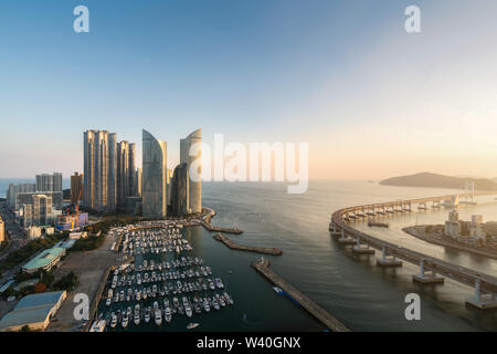 Busan city skyline view at Haeundae district, Gwangalli Beach with yacht pier at Busan, South Korea. Stock Photo