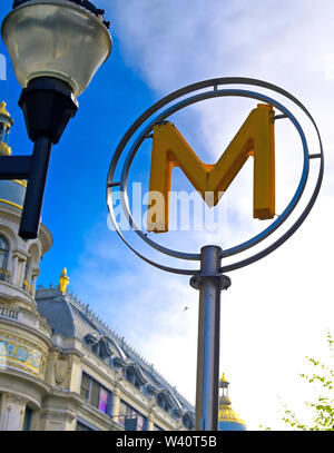 Paris, France - April 21, 2019 - A sign that marks the entrance to a metro station for the Paris underground subway system in France. Stock Photo