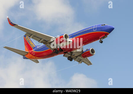 A Southwest Airlines Boeing 737 jet shown approaching the Los Angeles International Airport, LAX, for landing. Stock Photo