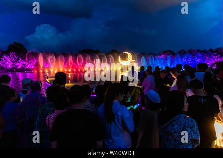 Jilin, Jilin, China. 19th July, 2019. Jilin, CHINA-The musical fountain lighting show in Jingyuetan national forest park in Changchun, capital of northeast China's Jilin province, opens on July 1, 2019.Music fountain waterscape light show is located in the goddess square at the main entrance of jingyuetan, taking the statue of the goddess of the clear moon as the central point, composed of fountain, LED beam light, LED full color tree light, LED full color wash wall light, pattern light, etc., which can combine hundreds of action forms. Credit: SIPA Asia/ZUMA Wire/Alamy Live News Stock Photo