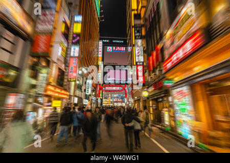 Walking along Kabukicho in Tokyo Stock Photo
