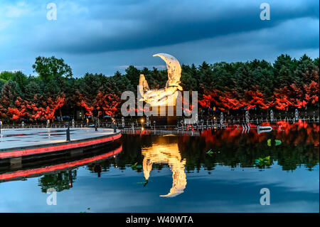 Jilin, Jilin, China. 19th July, 2019. Jilin, CHINA-The musical fountain lighting show in Jingyuetan national forest park in Changchun, capital of northeast China's Jilin province, opens on July 1, 2019.Music fountain waterscape light show is located in the goddess square at the main entrance of jingyuetan, taking the statue of the goddess of the clear moon as the central point, composed of fountain, LED beam light, LED full color tree light, LED full color wash wall light, pattern light, etc., which can combine hundreds of action forms. Credit: SIPA Asia/ZUMA Wire/Alamy Live News Stock Photo