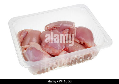 Chicken meat fresh legs  without  bones and skin in the standard  opened plastic container. Isolated on white macro Stock Photo