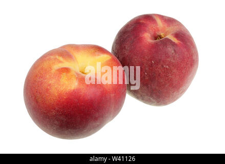 Two ripe red peaches are on the table. Isolated on white macro Stock Photo