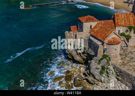 Aerial view of Budva Old Town from the Citadel with Richard s Head beach and Adriatic Sea in the background in Montenegro, Balkans on a sunny day Stock Photo