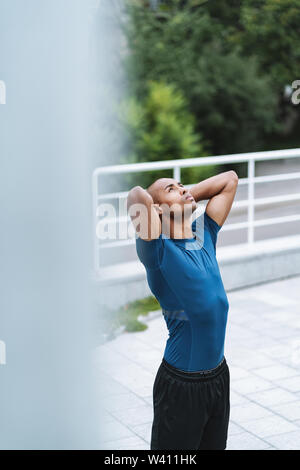 Image of handsome young strong sports man posing outdoors. Stock Photo