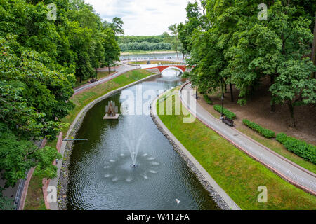 Swan pond with fountain in the city park of Gomel, Belarus Stock Photo