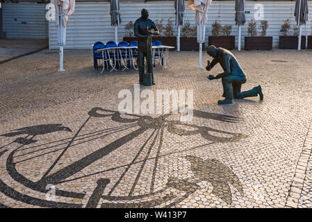 Monument to the pavers (Monumento ao Calceteiro)  this typical figure at Praça dos Restauradores of Lisbon, Portugal Stock Photo