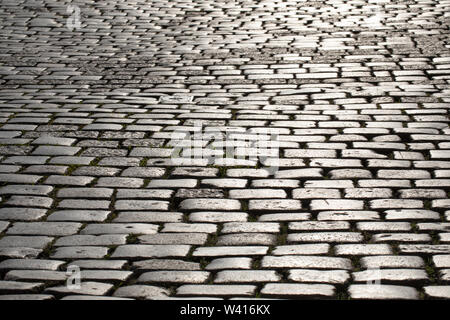 The cobbles, stone sett surface, paving in the old town in Poznan, Stock Photo
