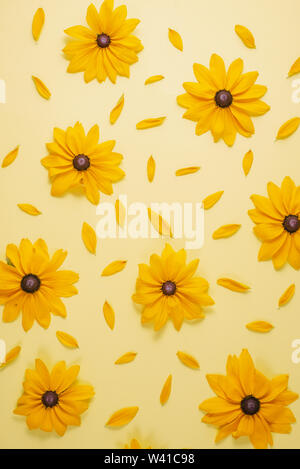 Flowers composition. Pattern made of yellow flowers on yellow background. Summer and autumn concept. Flat lay, top view, copy space Stock Photo